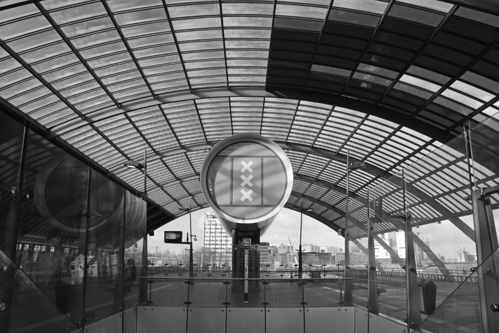 Central station, bus platform in Amsterdam in black and white